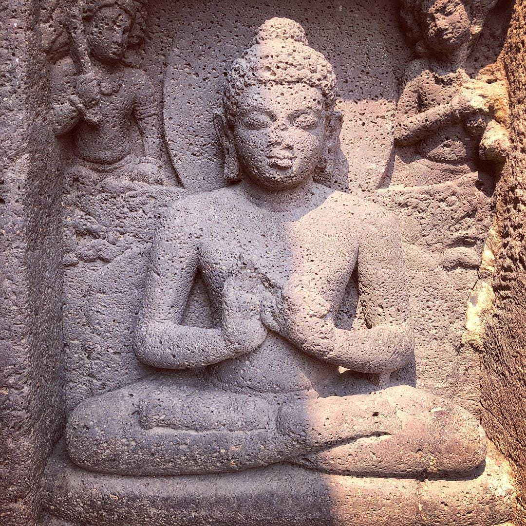 Detail from a carving in stone at the Mahabodhi Temple, Bodh Gaya, of the Buddha