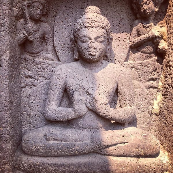 Detail from a carving in stone at the Mahabodhi Temple, Bodh Gaya, of the Buddha